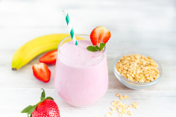Strawberry milkshake smoothie with banana and oatmeal. Healthy breakfast. Dietary and healthy menu. 