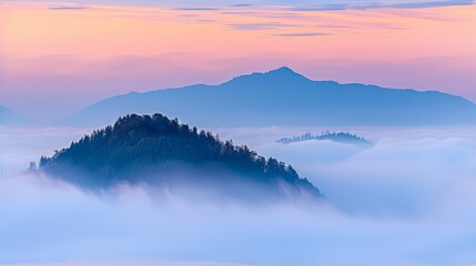 Fototapeta premium a mountain covered in fog with trees in the foreground and a pink and blue sky with clouds in the background.