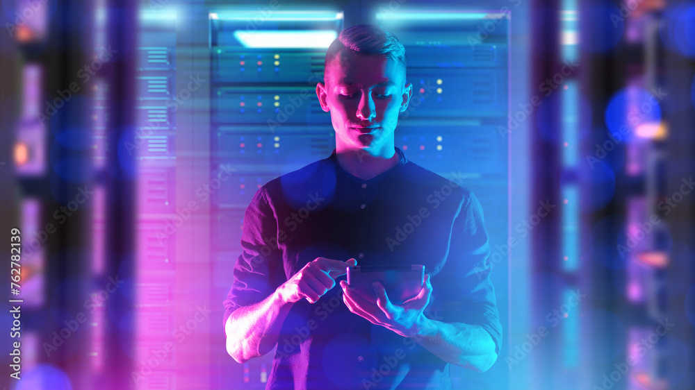Poster man system administrator. guy among server equipment. specialist from hosting company. system admini