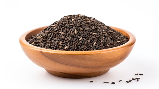Pile of bird niger seed (Guizotia abyssinica) in wood bowl isolated on white background.


