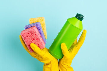 Sponges and detergent in hands