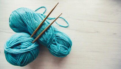 craft hobby with vintage knitting needles yarn ball on white background still life photo with soft focus view from above handicraft day concept space text crochet background blue pastel theme