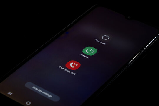 Power off or restart on Samsung Android phone, phone page screen, smartphone screen with black background, power off restart or emergency call mode: Istanbul, Turkey - 12.03.24