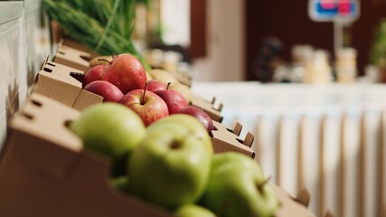 Close up panning shot of natural fruits and vegetables on farmers market shelves. Freshly harvested additives free food items in environmentally responsible zero waste supermarket