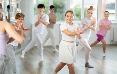 Fototapeta premium Group of children boys and girls dance jazz funk in studio