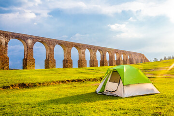 Camping tent in front of aqueduct in arcos del sitio in tepotzotlan