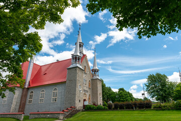 A catholic church on a blue sky