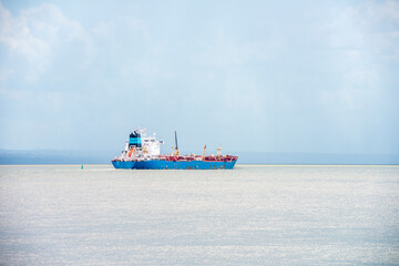 A big freight ship in the Saint-Lawrence river fog