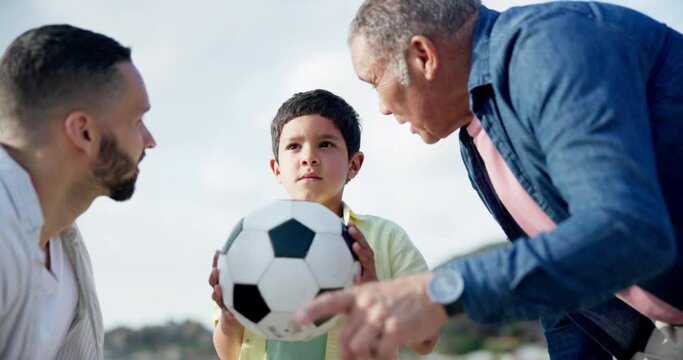 Teaching, soccer and family with child in game outdoor on summer, holiday or learning on vacation. Dad, grandfather and advice for kid with ball or talk together, bonding about football and sport