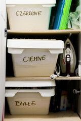 white box on shelf in a laundry room 
