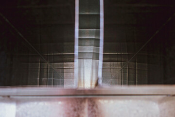 view inside the duct, large square section, blurred foreground and background with bokeh effect