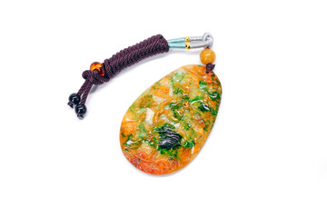 Jade pendant isolated on white background. Tri color Jadeite jade pendant with mountain, waterfall,...