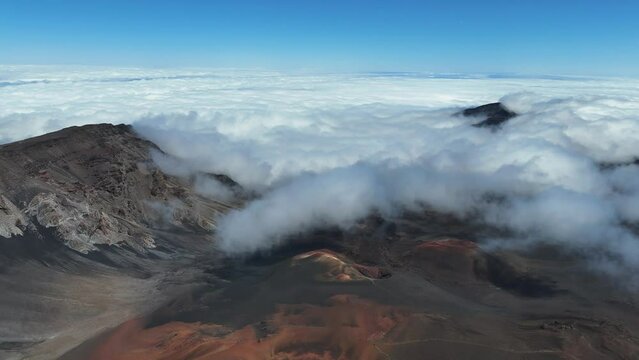 Haleakala Crater looms 10,023 feet above the Pacific Ocean, taking up three-quarters of Maui’s 727 square miles. Haleakala sunrise inspire 1.5 million visitors annually.
