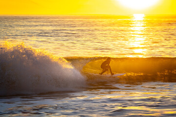 Surfer Rides Wave in Southern California