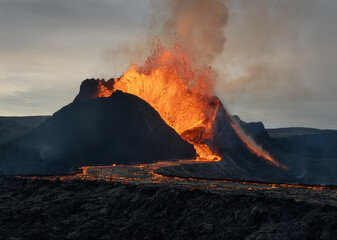 Volcanic eruption explosion and lava flow in the lava field of Fagradalsfjall, Geldingadalir, ...