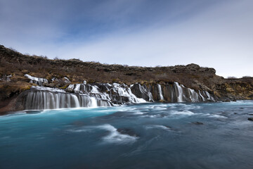 Hraunfossar waterfall, streams and river in lavafield of Iceland