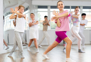 Fototapeta premium Group of children boys and girls dance jazz funk in studio