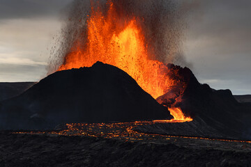 Volcanic eruption explosion and lava flow in the lava field of Fagradalsfjall, Geldingadalir, ...