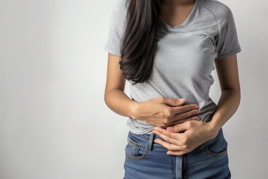 Person with stomach pain on a white background, stomachache, Abdomen bloating concept