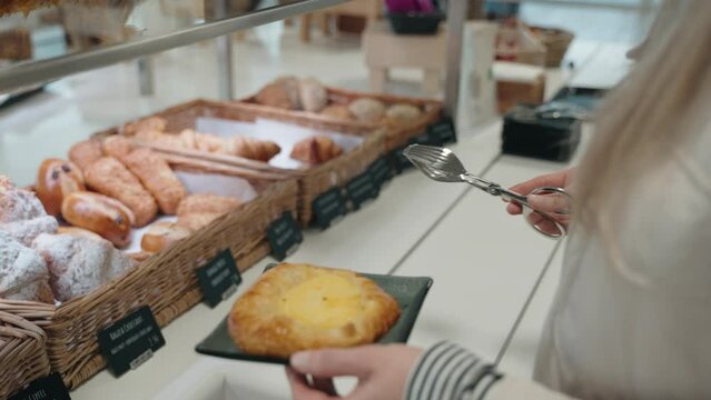 Closeup of hands taking pastry's early morning