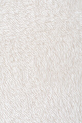 white plush fabric texture background, background pattern of soft warm material