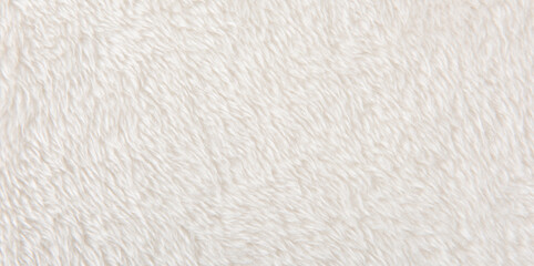 white plush fabric texture background, background pattern of soft warm material © zhikun sun