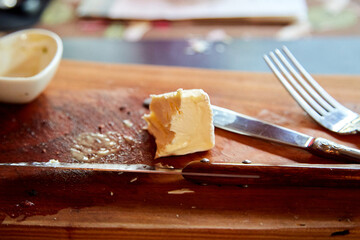 Close-Up of Brie on a Cutting Board with Utensils