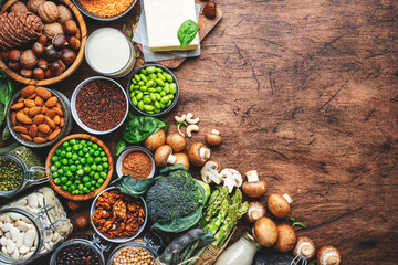 Vegan food background with empty space. Plant protein., vegetarian nutrition sources. Healthy eating, diet ingredients: legumes, beans, lentils, nuts, soy milk, tofu, cereals, seeds 
