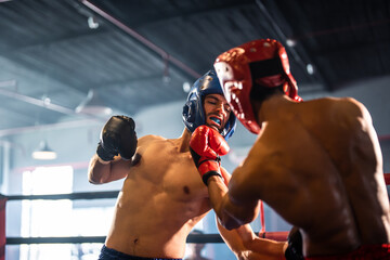 Two young professional boxer having a competition tournament on stage.  © Kawee