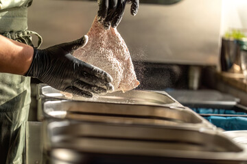 Authentic breading process of a cordon bleu schnitzel