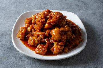 A view of a plate of orange chicken.