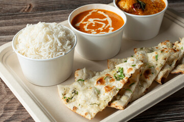 A closeup view of a garlic naan spread.