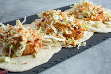 A closeup view of shrimp tacos.