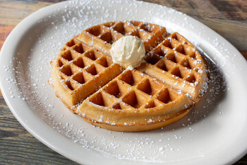 A closeup view of a waffle plate.