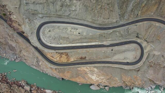 Aerial Birds Eye View Of Winding Jaglot Skardu Road - JSR That Connects Gilgit region to Baltistan region of Gilgit Baltistan. Pedestal Up Shot