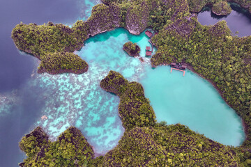 Turquoise tropical lagoons on Piaynemo in Indonesia's Raja Ampat, West Papua - obrazy, fototapety, plakaty
