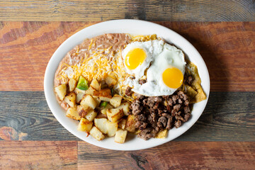 A top down view of a plate of chilaquiles.