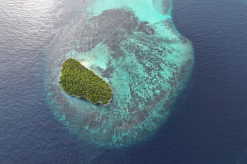 Pantai Timbul Sandbar, coral reef, and Koh island near Cape Kri