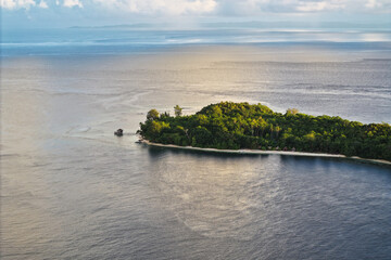 Dusk over a tropical island in Indonesia's West Papua province in the Raja Ampat region.
