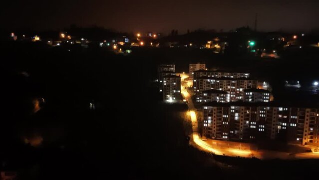 night time view of a city with a lot of buildings and lights