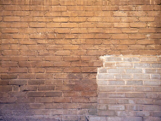 Textured Brick Wall with Varying Shades