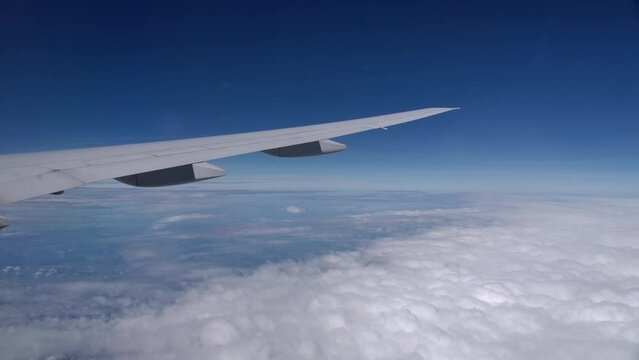 Slick Boeing B787 Airplane Wing in High Altitude Cruise Flight