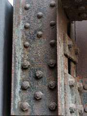 Rusty Metal Beam with Rivets