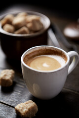Cup of coffee on rustic wooden background. Copy space.	