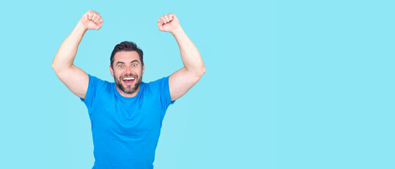 The winner. Successful man raising arms. Excited man with arms up celebrating success. Ecstatic excited male winner celebrating win. Overjoyed business man enjoy victory. - 762927921