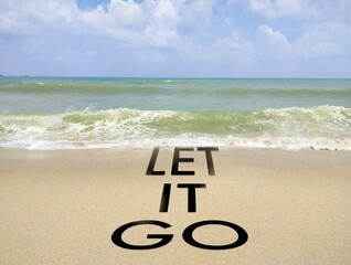 the words Let It Go with the background of waves on the beach