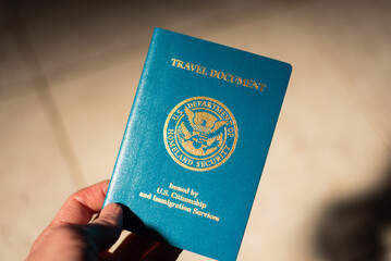 USA Re-entry Permit holding in hand with soft background