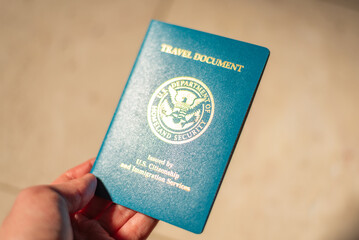 USA Re-entry Permit holding in hand with soft background and soft focus