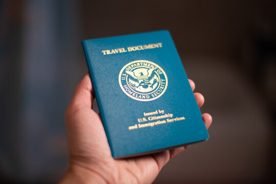 USA Re-entry Permit holding in hand with soft background