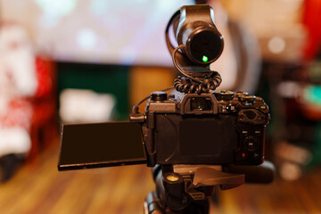 Professional video camera on blurred background. 